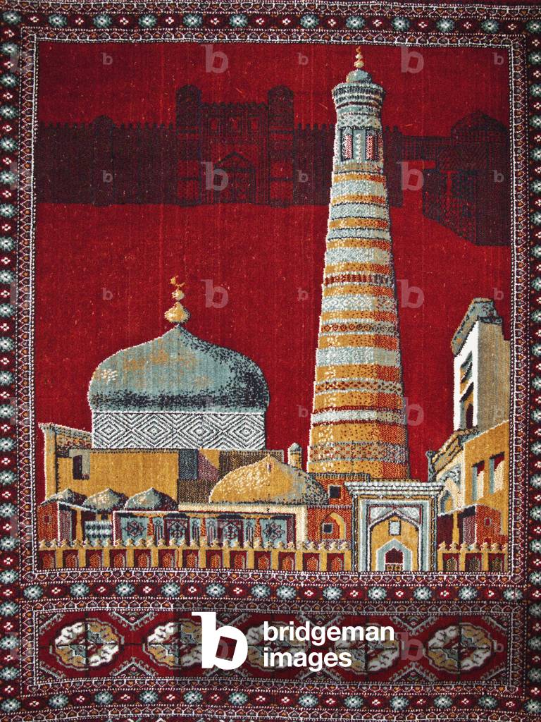 Locally made carpet showing Islam Khoja minaret (right) and dome of Pakhlavan Mahmoud Mausoleum (left), Ichan Kala Old City, Khiva, Uzbekistan (photo)