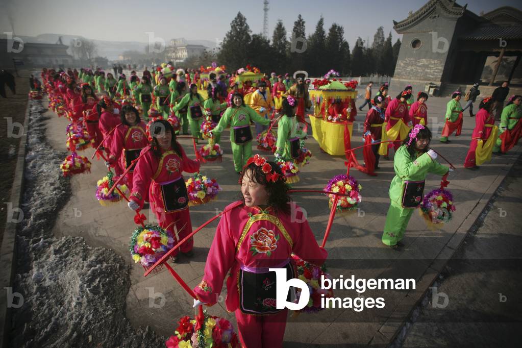 Colorfully Dressed Local Women in A Rural Chinese New Year Procession, at The Valley of The Shi Li River Located at The Base of The Wuzhou Shan Mountains, Near Datong, Shanxi, China (photo)