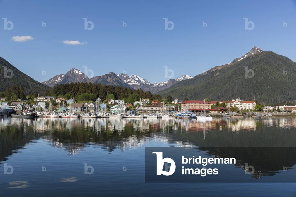 View of boats in Sitka Harbor and homes and the Sisters Mountains in the background, Sitka, Southeast Alaska, Summer (photo)