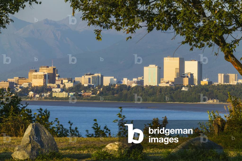 Anchorage Alaska city skyline, along the Cook Inlet at sunset; Anchorage, Alaska, United States of America (photo)