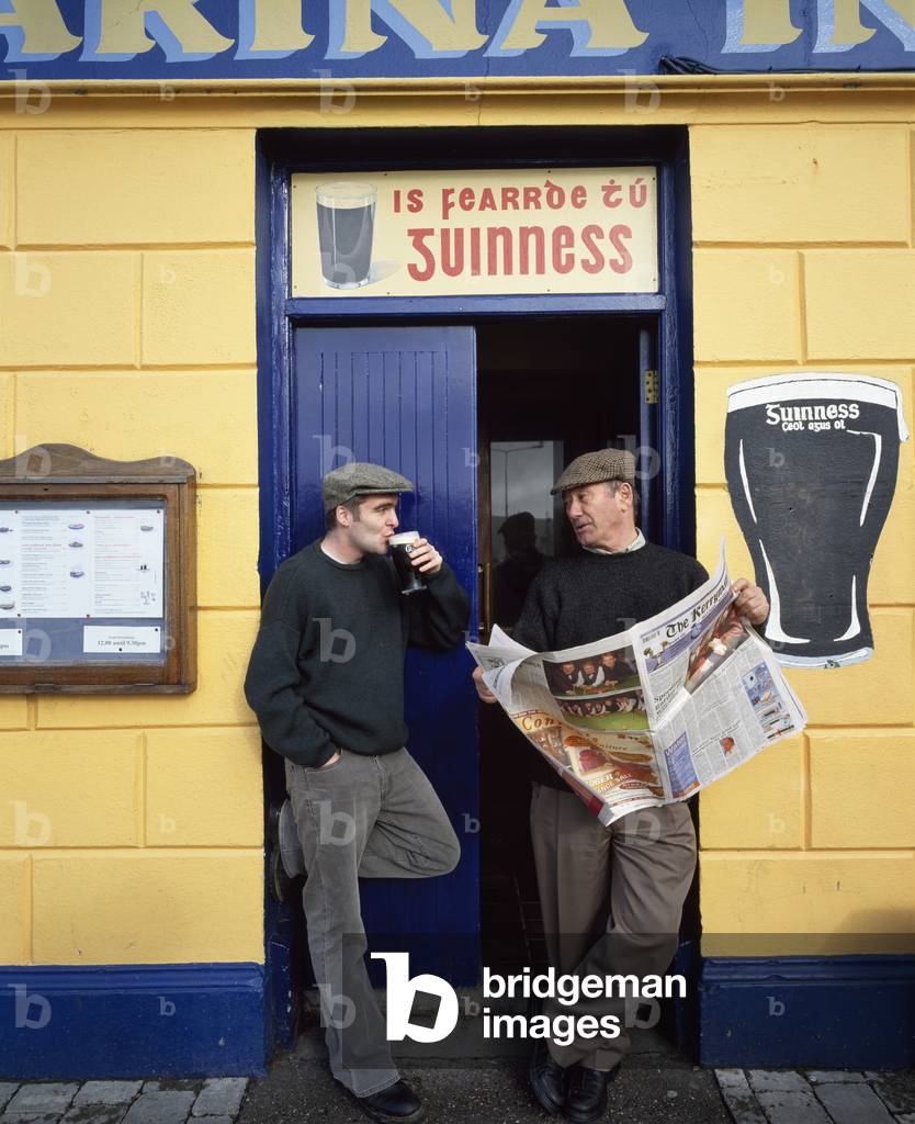 Dingle Town,Co Kerry,Ireland;Men Standing Outside Pub (photo)