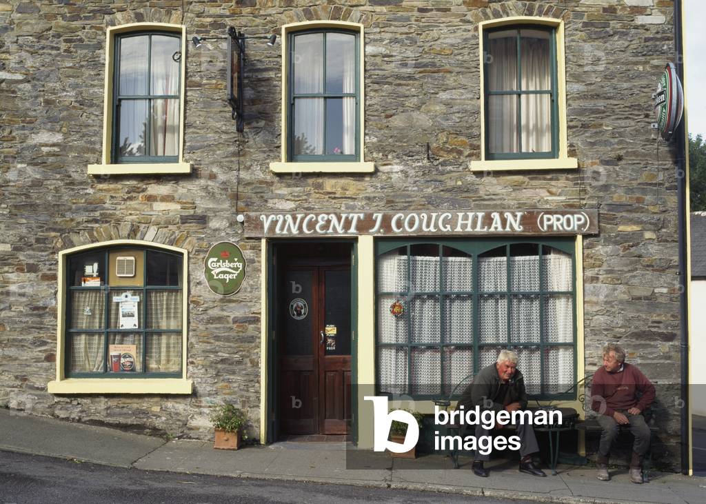 Two Men Sitting Outside A Pub (photo)