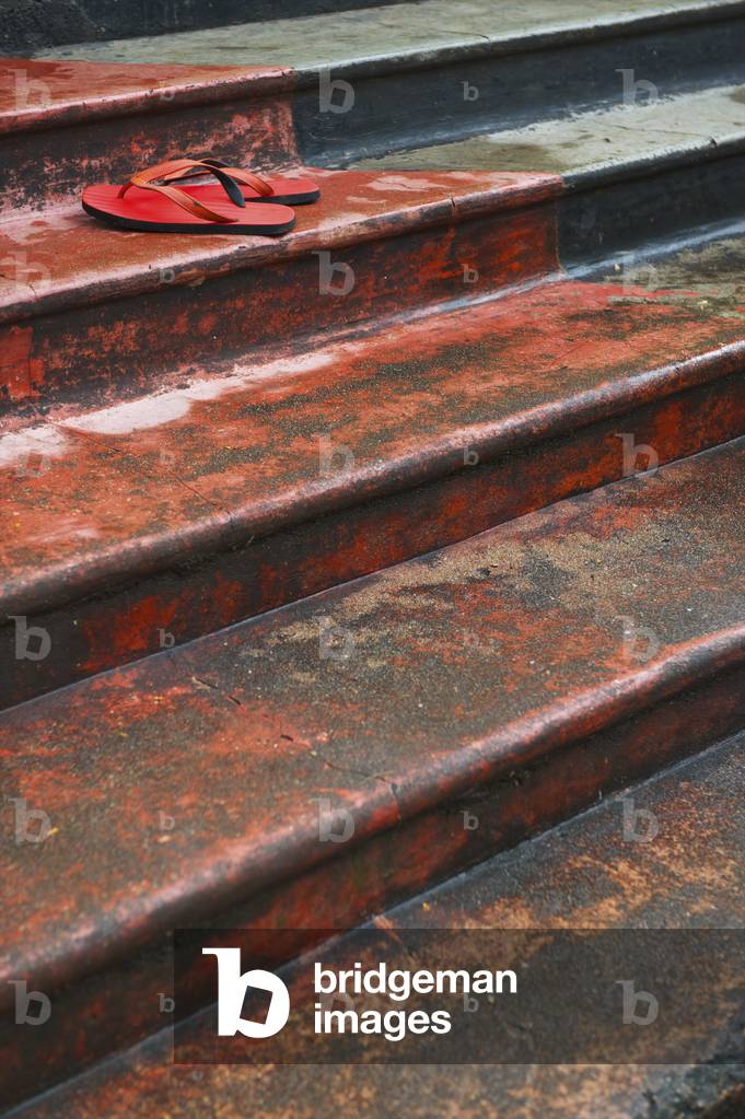 Flip flops sitting on steps, Ulpotha, Embogama, Sri Lanka (photo)
