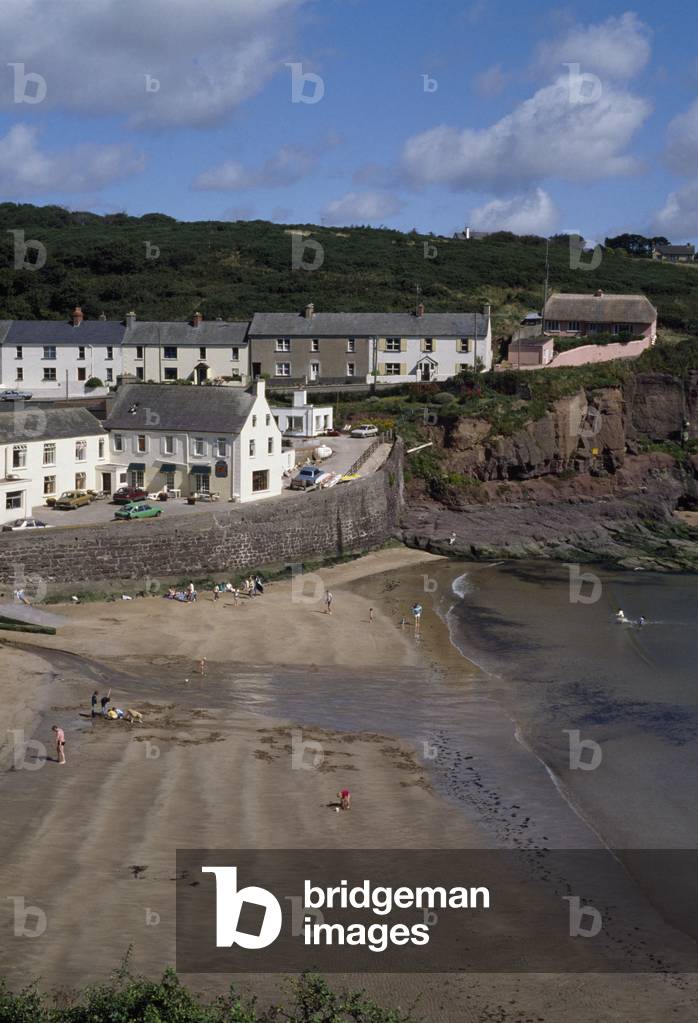 Dunmore East, Co Waterford, Ireland; High Angle View Of A Tourist And Fishing Village And People At The Beach (photo)