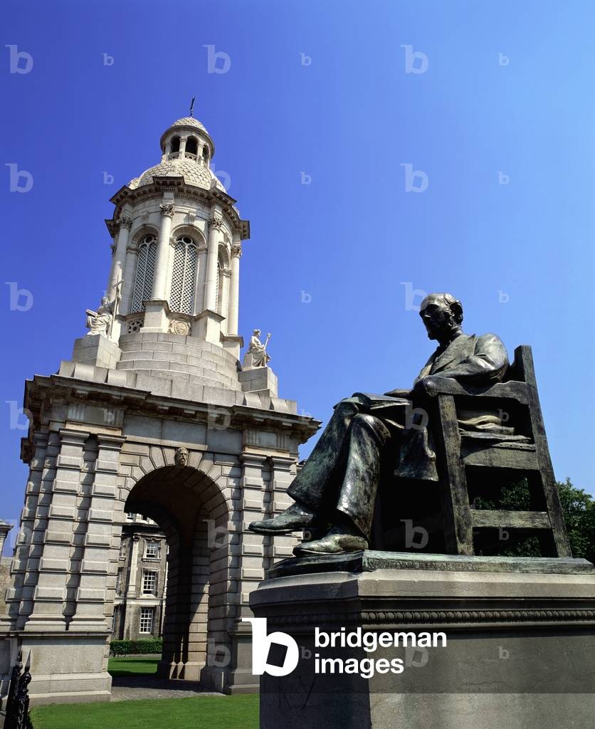 Statue Of A Man In Front Of An Education Building, Trinity College, Dublin, Republic Of Ireland (photo)
