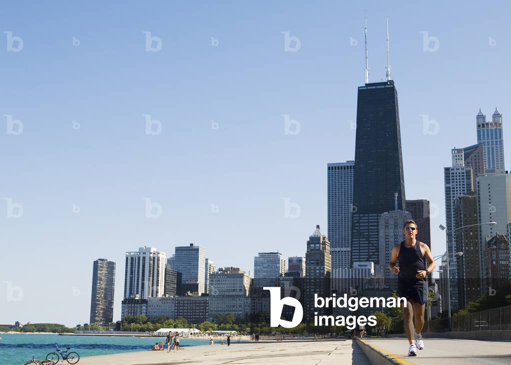 Man Jogging on Lakefront Path Along Oak Street Beach, Chicago, Illinois, USA (photo)