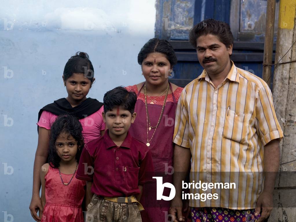 Portrait of Well Dressed Indian Family in front of Their Home, Kochi, Kerala, India (photo)