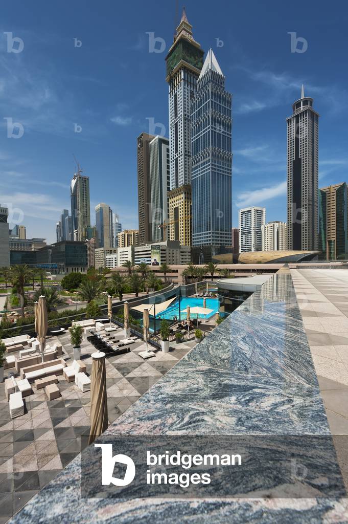 Looking Across Hotel Swimming Pool To Difc (Dubai International Financial Centre), Dubai, United Arab Emirates (photo)