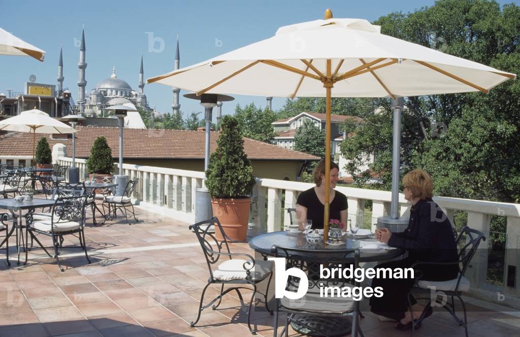 Two Tourist Women at Rooftop Terrace (photo)