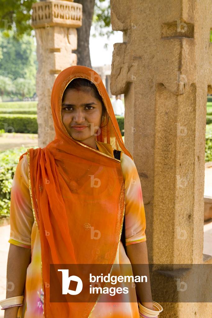 Qutub Minar Complex, Beautiful Woman in colourful Sari, New Delhi, India (photo)
