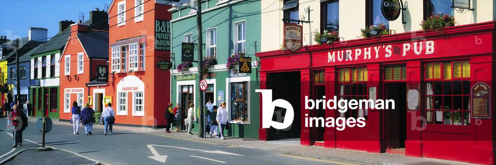 Dingle, Dingle Peninsula, Co Kerry, Ireland; Murphy's Pub And Shops In A Town (photo)
