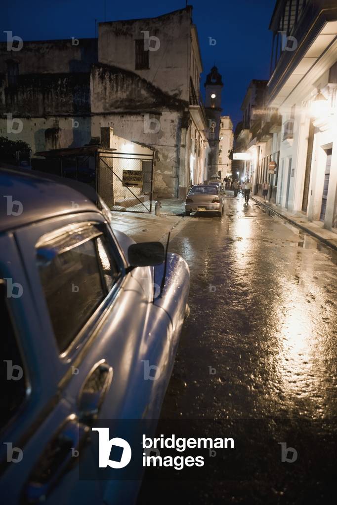 Cars Parked in Street at Night (photo)