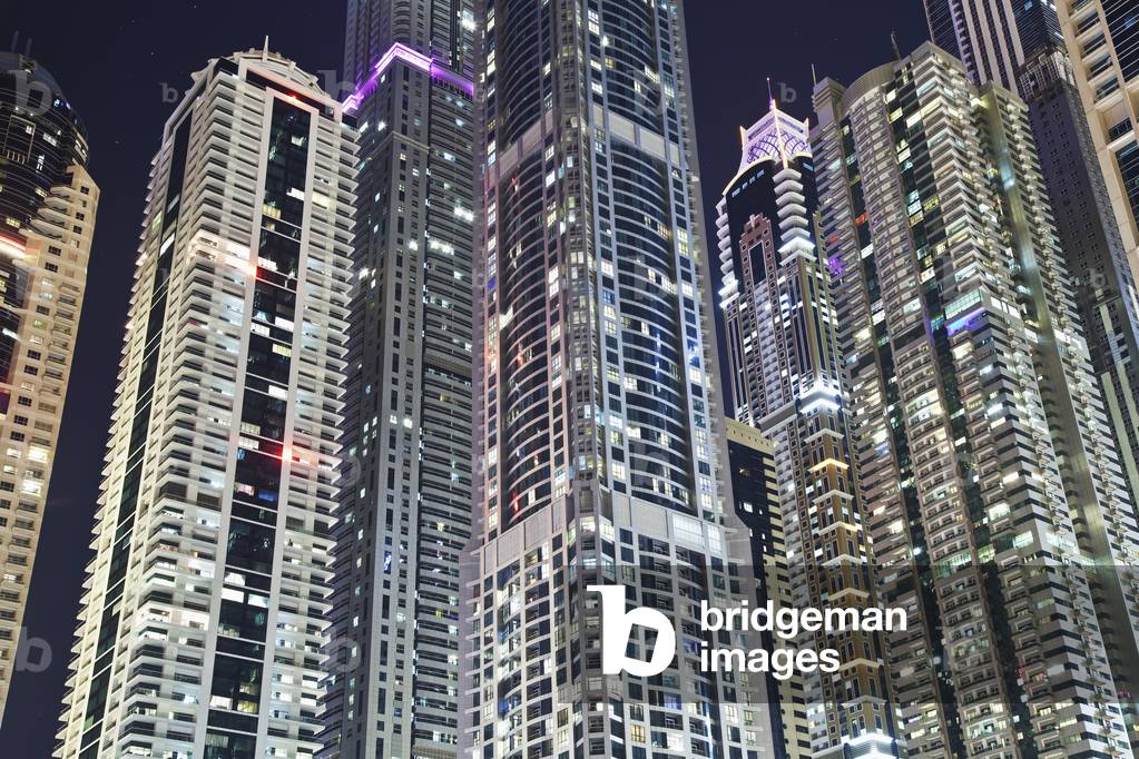Skyscrapers illuminated at nighttime, Dubai, United Arab Emirates (photo)