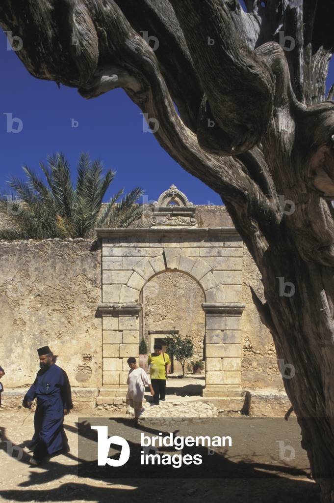 Orthodox Priest Visiting Moni Arkadi Monastery- Symbol of Cretan Independence Against Turkish Occupation- by Shaow of 'the Historic Cypress' (photo)