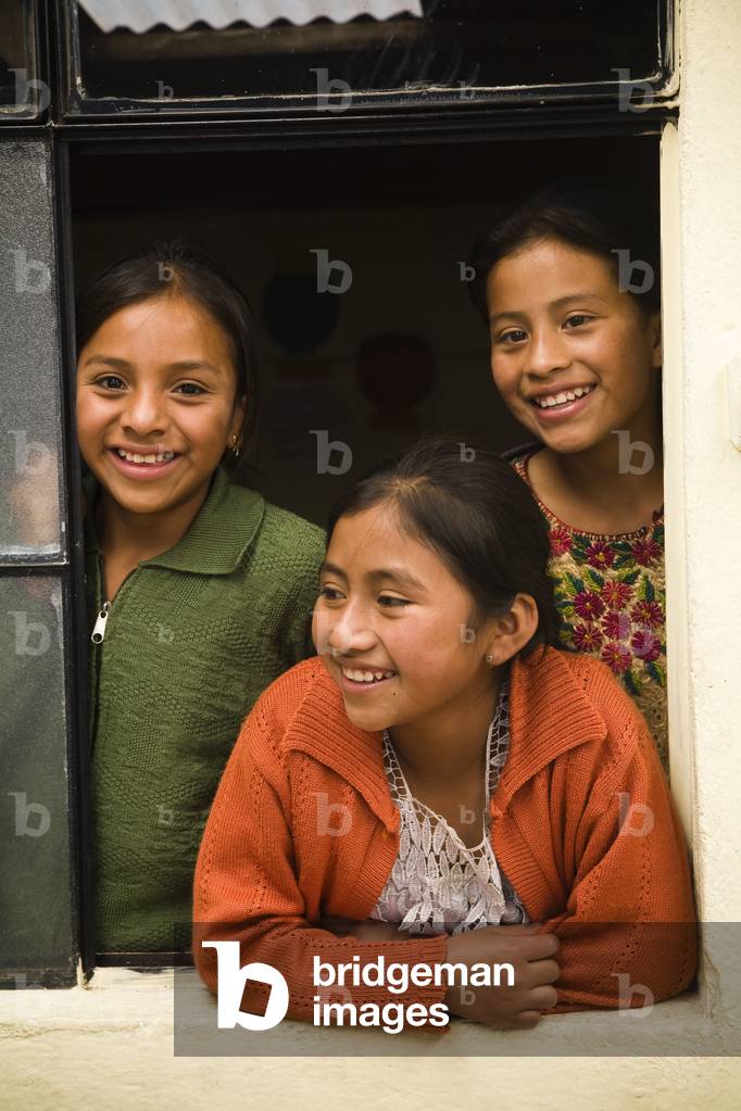 Three Smiling Girls in a Window Frame, Guatemala (photo)