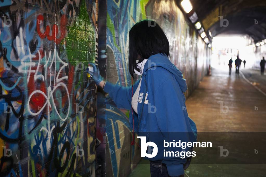 Woman Tagger at Leake Street, Graffiti Tunnel, Lambeth, London, England, UK  (photo)