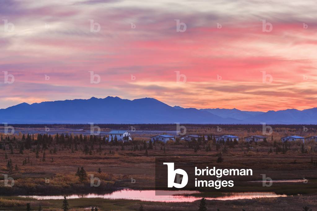 Scenic view of the village of Noatak with the Baird Mountains in the distance at sunrise, Arctic Alaska, USA, Autumn (photo)