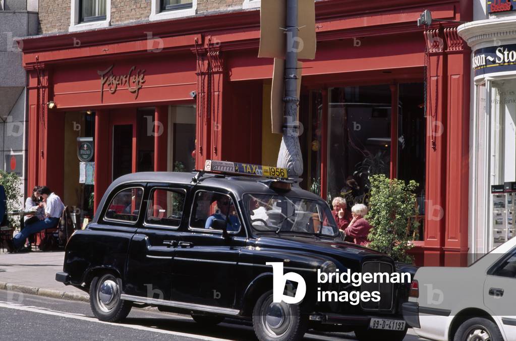 Dawson Street,Co Dublin,Ireland;Old-Fashioned Taxi Outside A Cafe (photo)