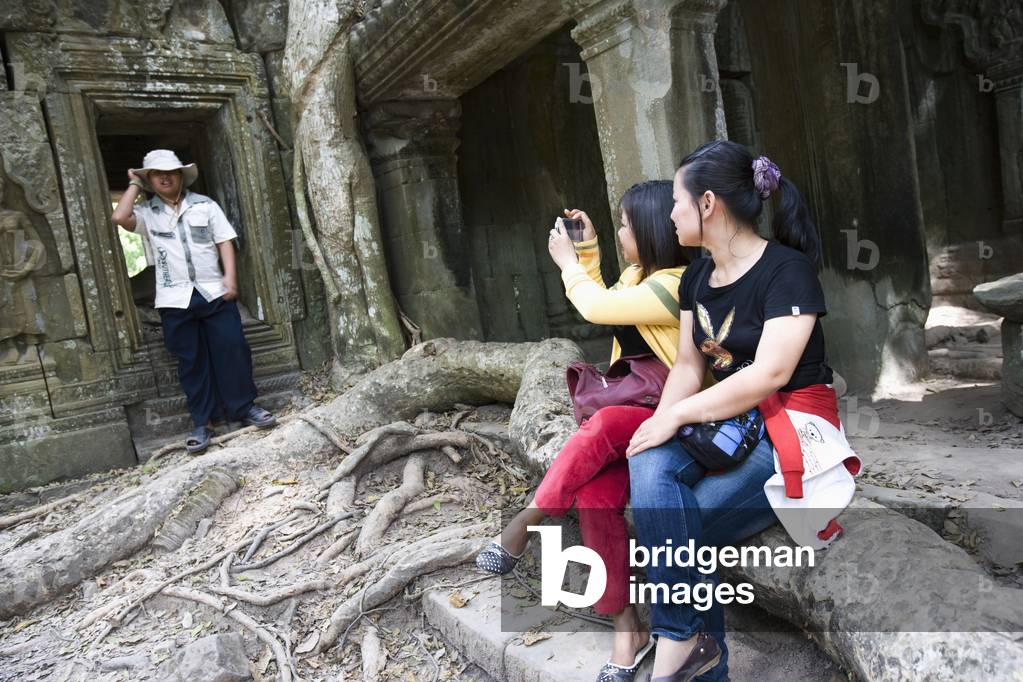 Tourists Taking Photo at Temple of Ta Prohm, Siem Reap, Cambodia (photo)