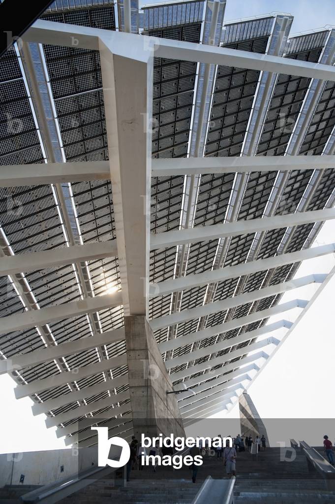 Spain, Parc del Forum, Barcelona, Festival goers under a huge solar panel in Primavera Sound music festival (photo)