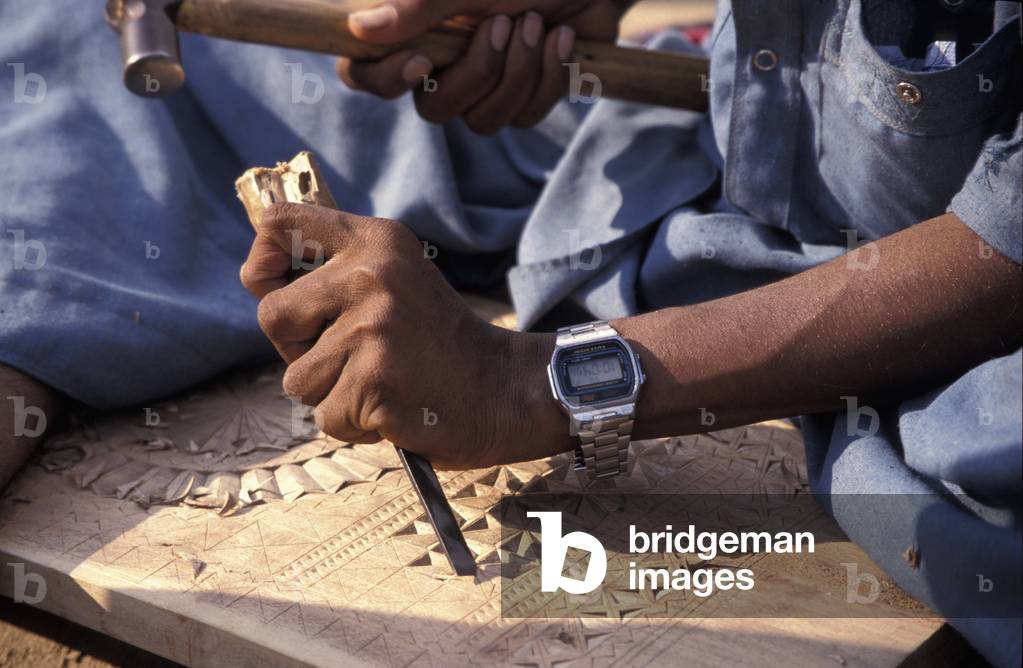 Detail of Man Woodworking at Ludia Harijan Village, North of Bhuj, Gujarat, India (photo)