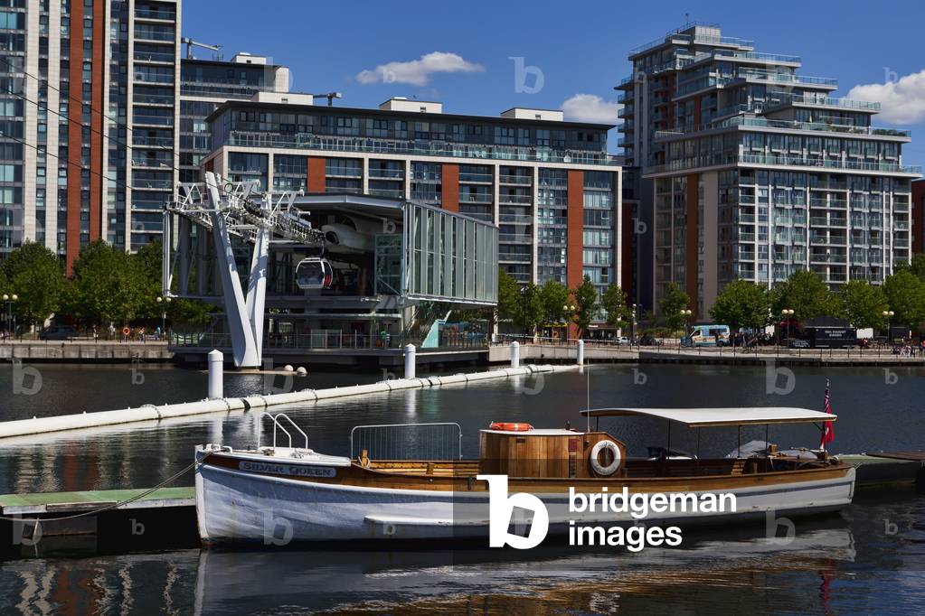 Vintage boat and new construction, Royal Victoria Docks, London, England, UK  (photo)