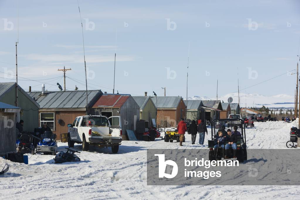 Locals outside on the streets of Noatak in early spring, Arctic Alaska, USA (photo)