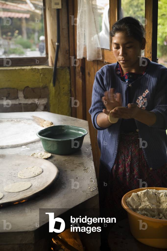 Central America, Young Woman Cooking Traditionally, Tecpan, Guatemala (photo)