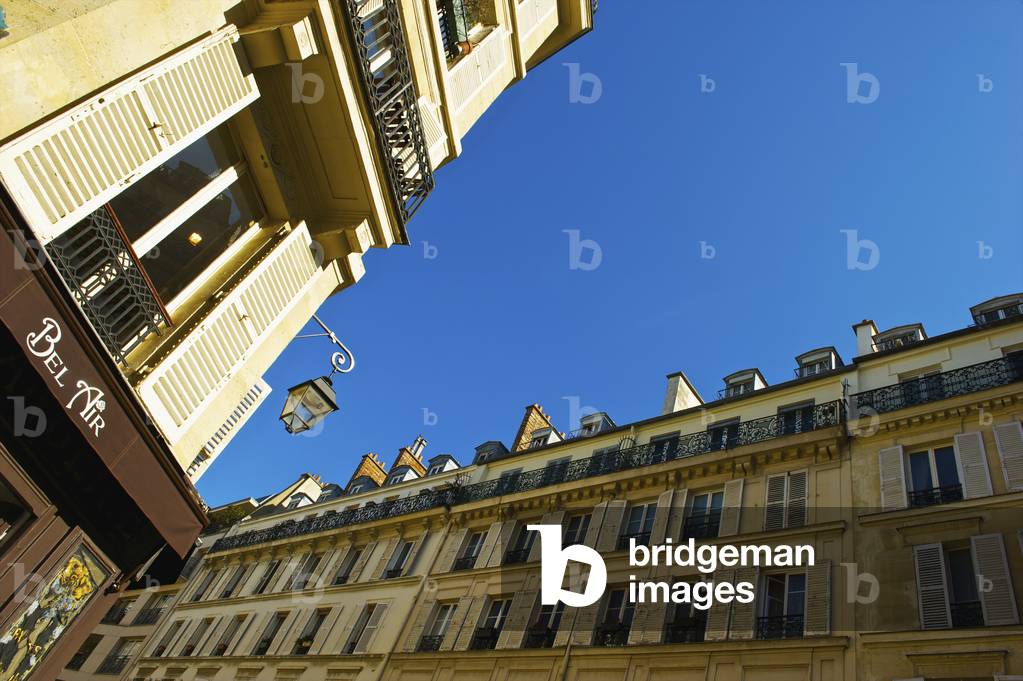 Residential buildings and a blue sky in the historical district of Marais, Paris, France (photo)