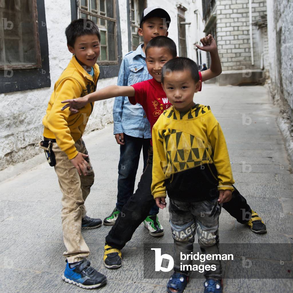 Four boys together in alley, Tibert, Xizang, China (photo)