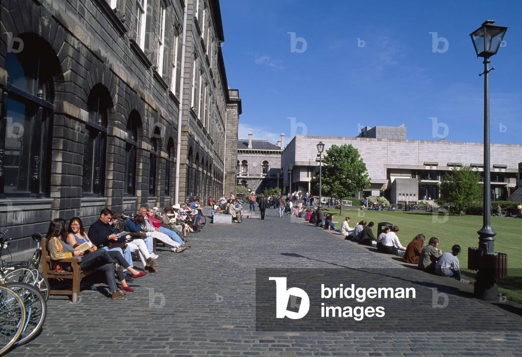 Trinity College, Dublin, Co Dublin, Ireland; Students Sitting Outside Of A Campus Library (photo)