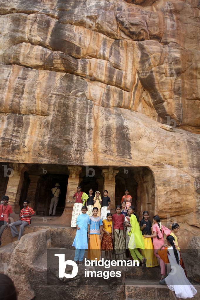 Local tourists at fifth century cave temples, Badami, Karnataka, India (photo)