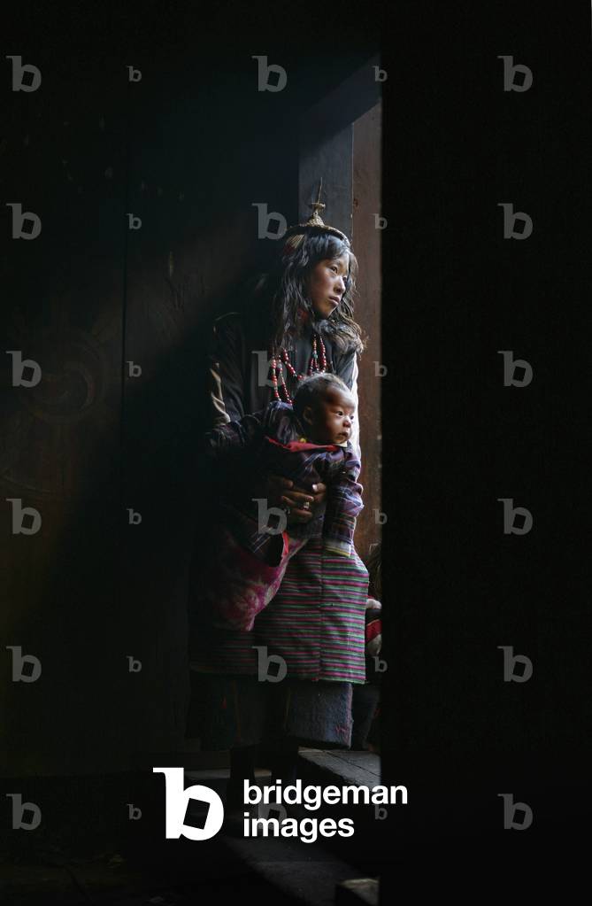 A Layap Girl Holding A Baby in Koina (photo)