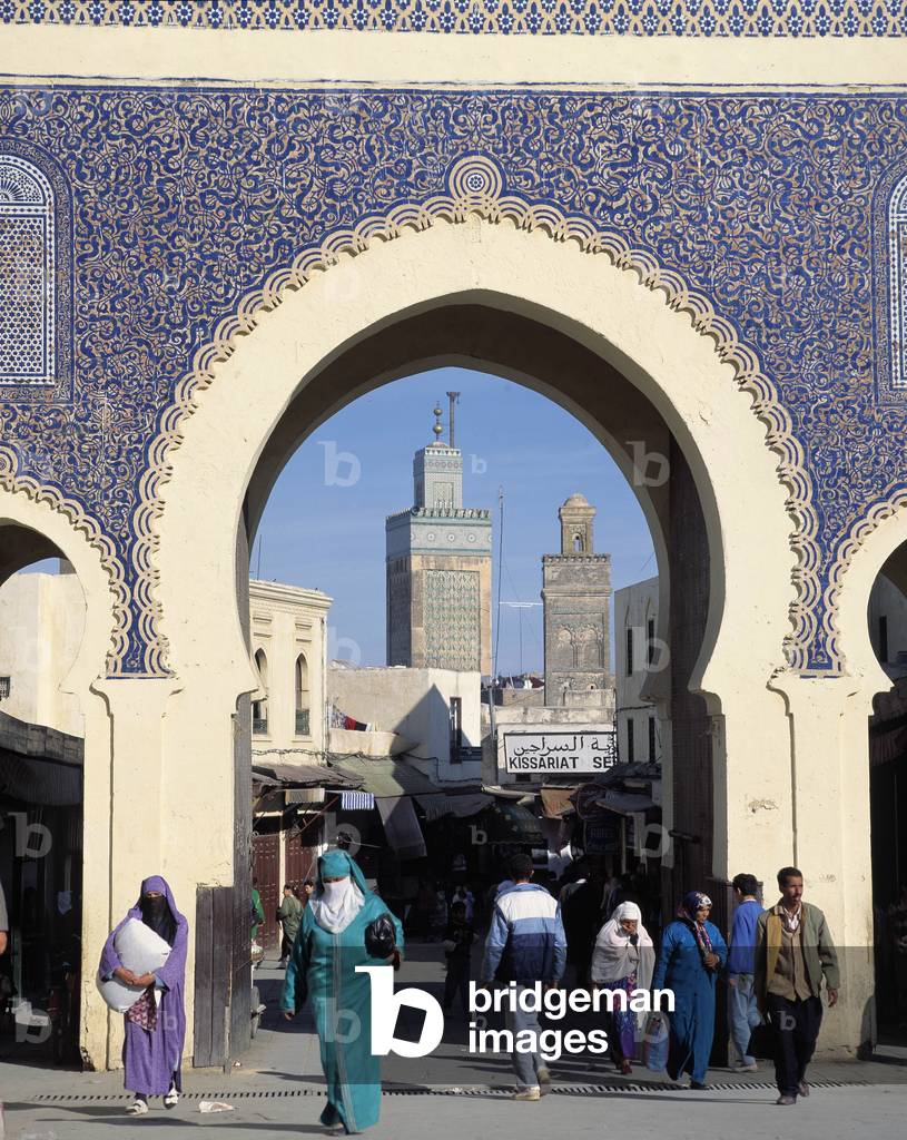People Walking By City Gate (photo)