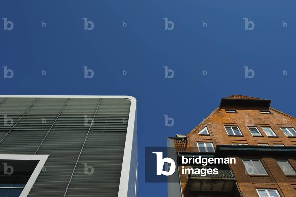 Low angle view of two buildings with a contrast in architecture, Hamburg, Germany (photo)