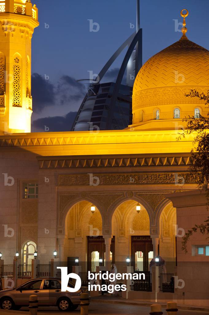 Small mosque with the Burj Al Arab hotel behind, Dubai, United Arab Emirates (photo)