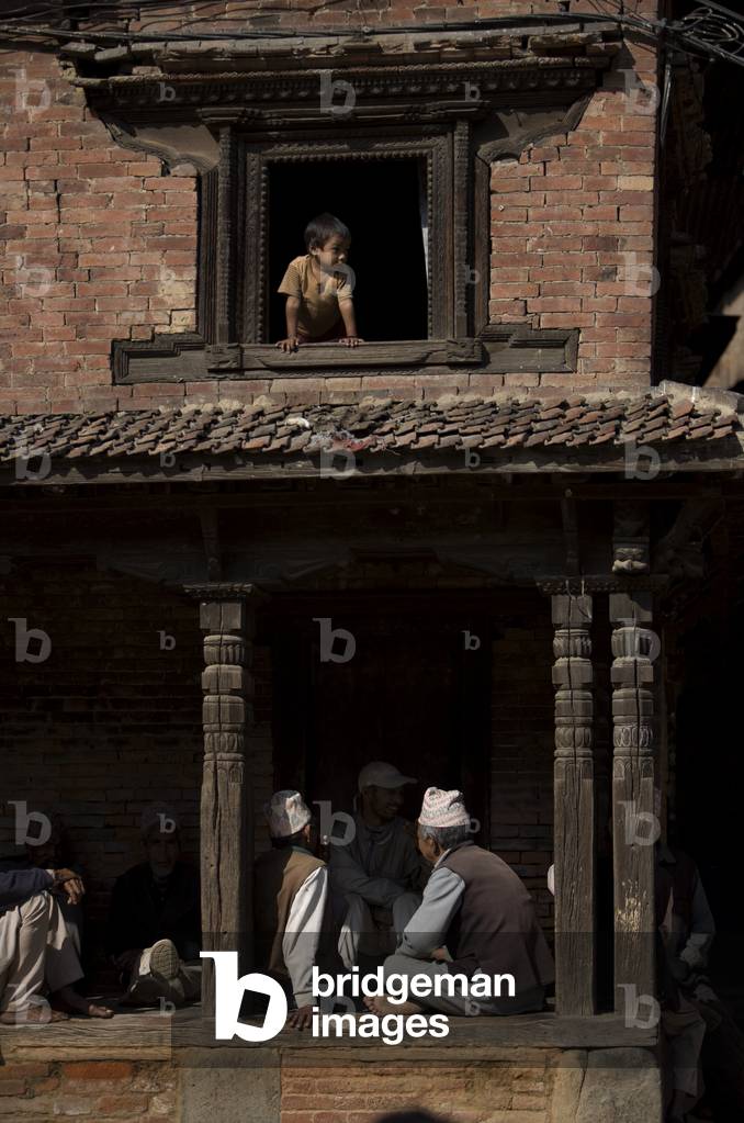 Locals sitting on Porch, Ancient City of Bhaktapur, Nepal (photo)