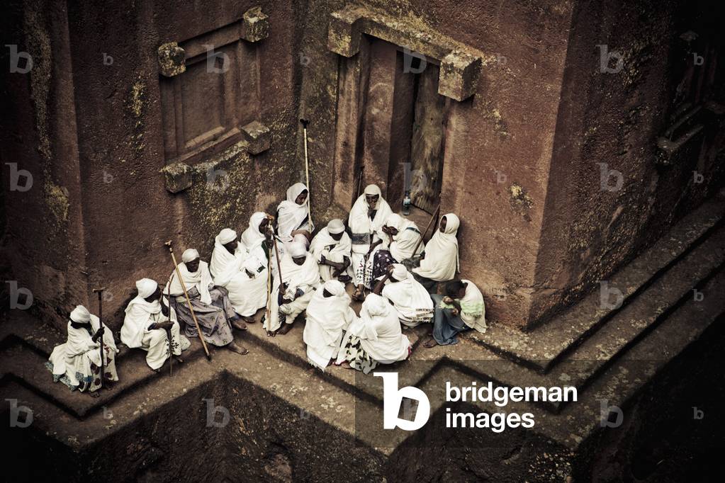 Pilgrims at the preserved rock-hewn Church of Saint George, or Bete Giyorgis, Lalibela, Ethiopia (photo)