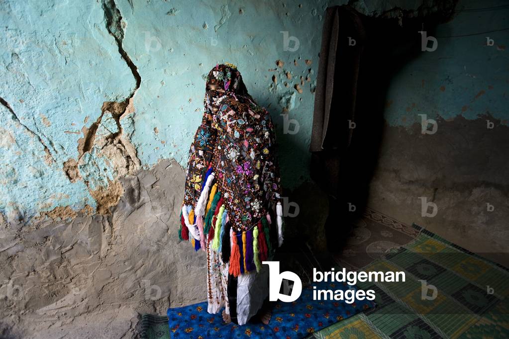 Woman Standing in Siwan House (photo)