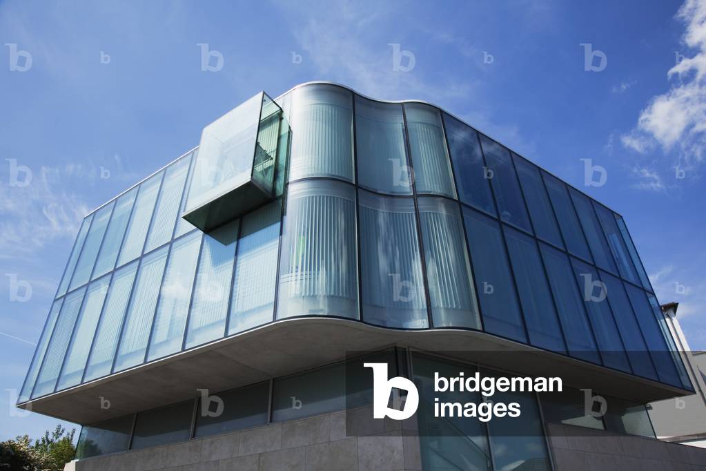 A modern building with curved glass walls; Galway City, County Galway, Ireland (photo)