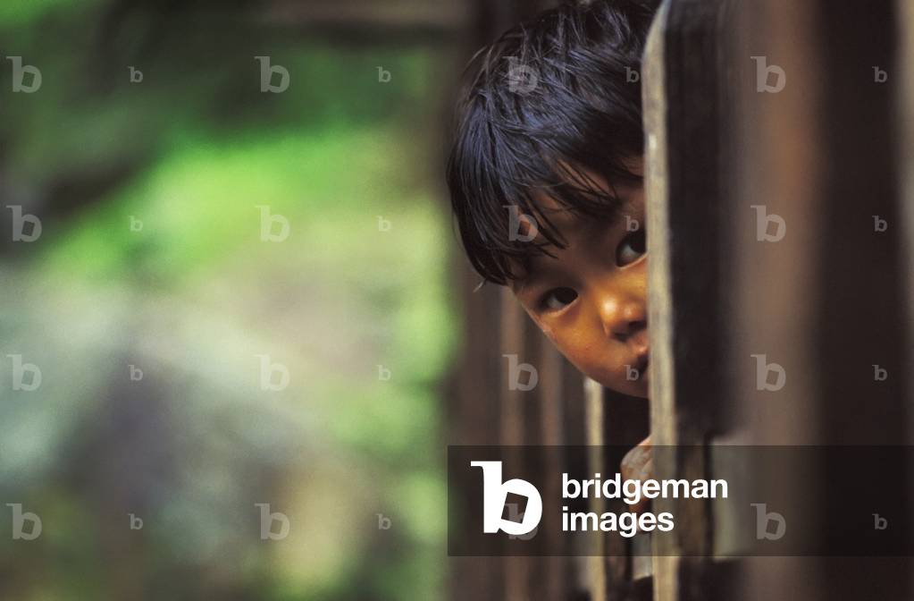 Young Child looking from behind Bars, Tegucigalpa, Honduras (photo)
