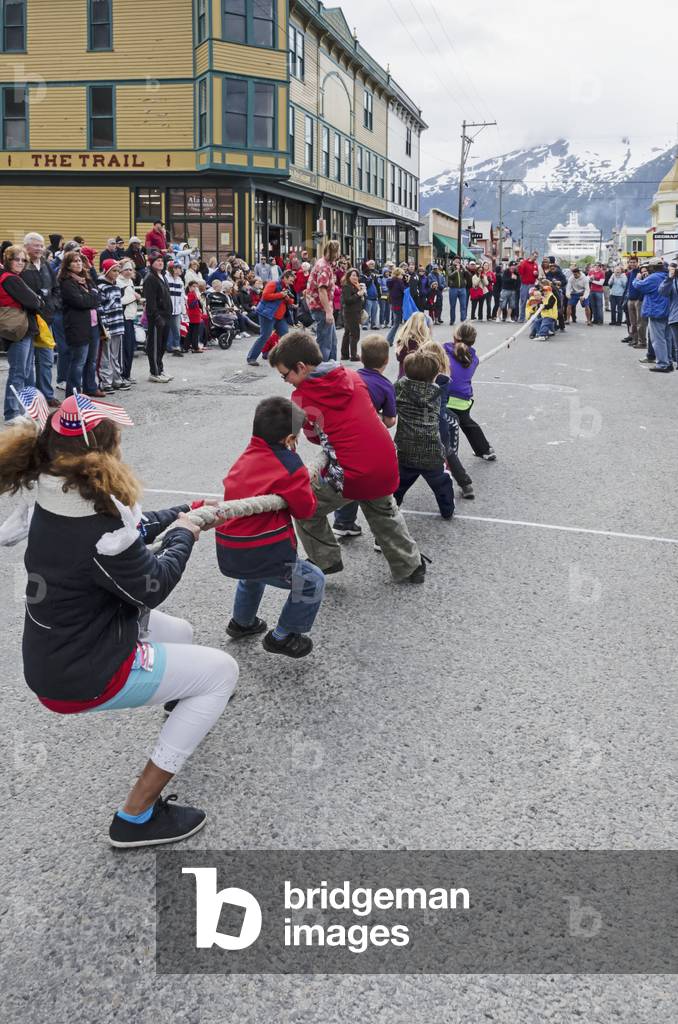 Children compete in Tug of War on Broadway in downtown Skagway, Alaska during the Fourth of July celebration (photo)