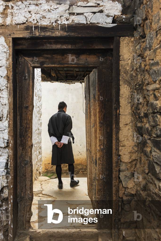 A man walking on a path, Tachog Lhakhang Dzong, Paro, Bhutan (photo)