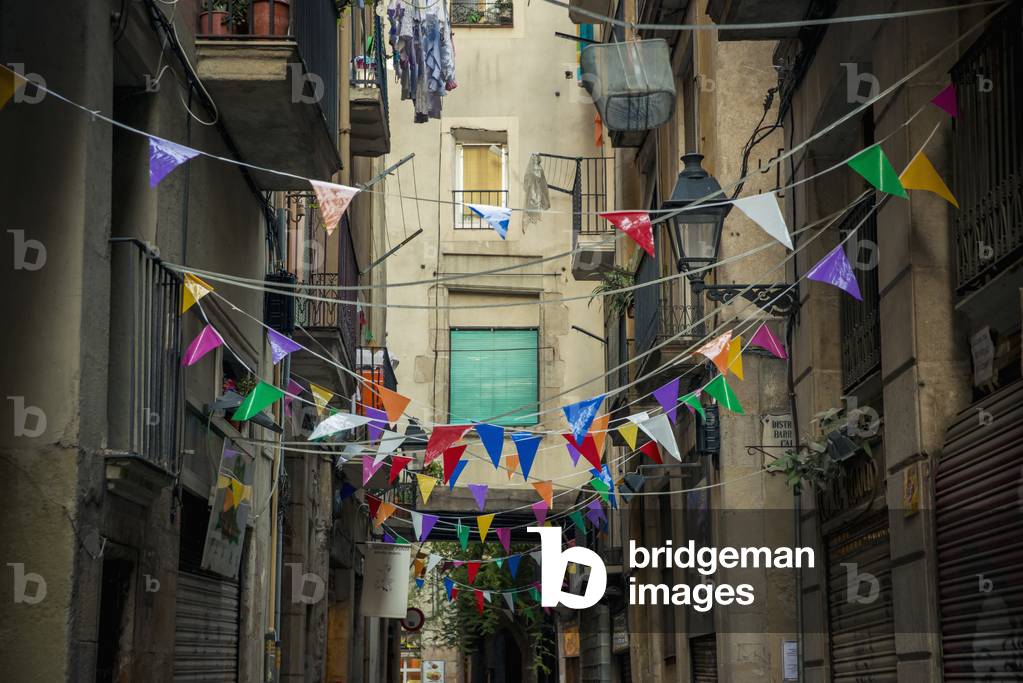 Coloured bunting decorating a street, Barcelona, Catalonia, Spain (photo)