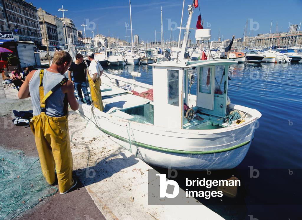 Fishermen Sorting Out Fishing Nets (photo)