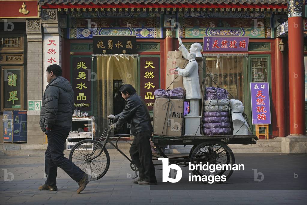 A Cycle Rickshaw Driver Carries Statues of Chairman Mao Zedong From Panjiayuan Flea Market, Beijing's Largest Antique Market, Beijing, China (photo)