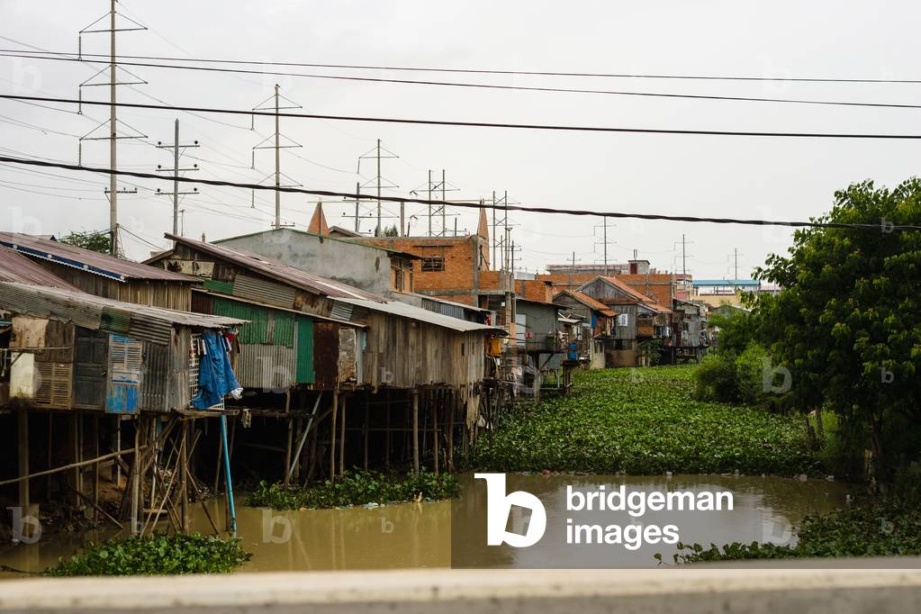 Phnom Penh, Houses on stilts with water below, Cambodia (photo)