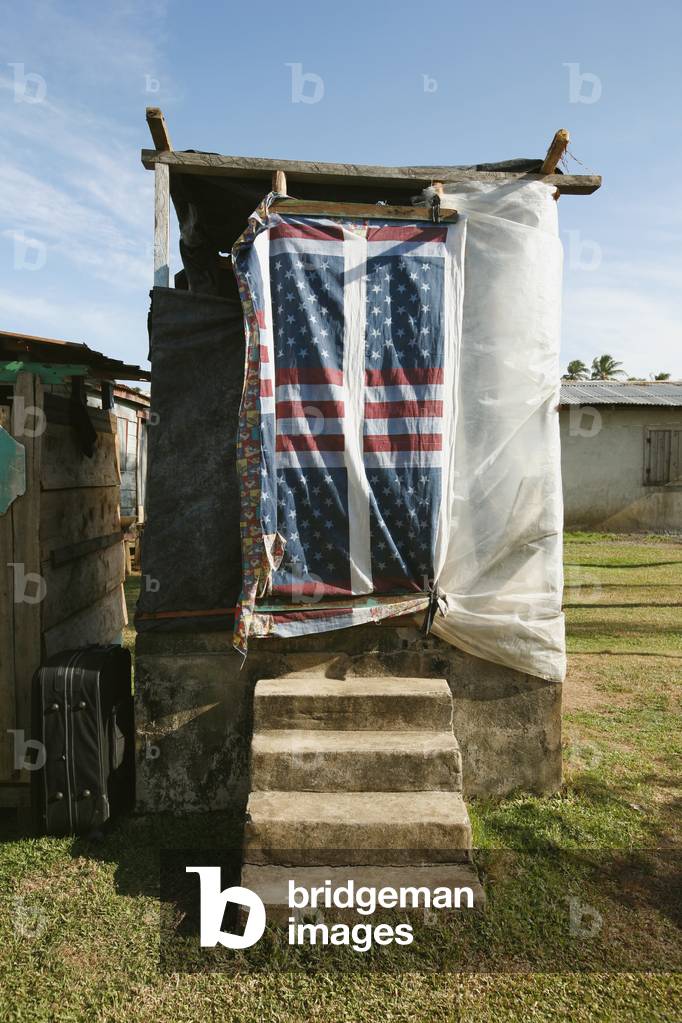 Flag hanging over Bathroom Door, Tasbapauni, Nicaragua (photo)