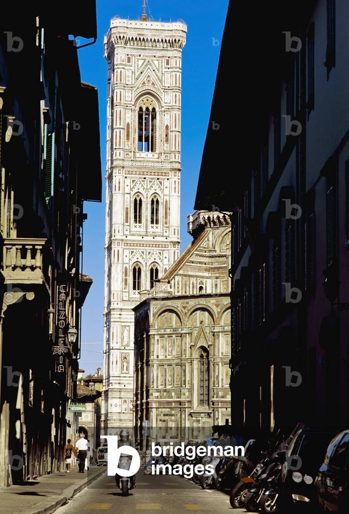 Man on Scooter going down alley in front of Duomo Santa Maria Del Fiore, Florence, Tuscany, Italy (photo)