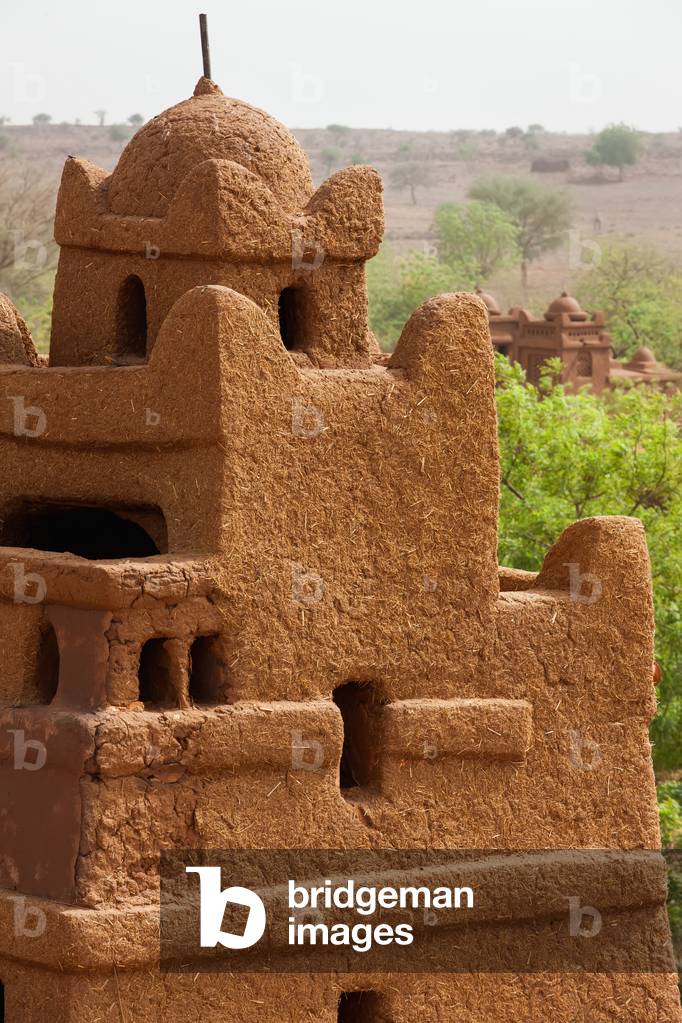 Close up view of one of corner towers of Yaama mud brick mosque, Yaama Village, Niger (photo)